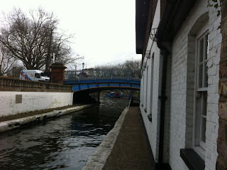 Road bridge over the Grand Union Canal just as it opens out into Paddington Basin