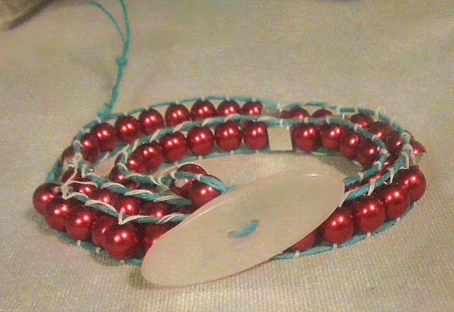 Red, turquoise, silver, and white speed of light bracelet is a unique STEM science physics sciart gift for scientists and teachers.