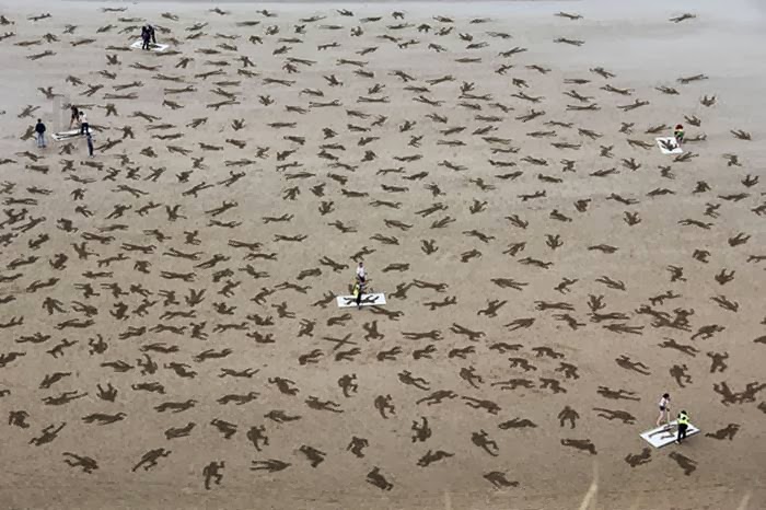 9,000 bodies stenciled on Normandy beach to honour WWII dead