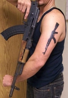 AK47 gun tattoo on arm