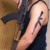 AK47 gun tattoo on arm