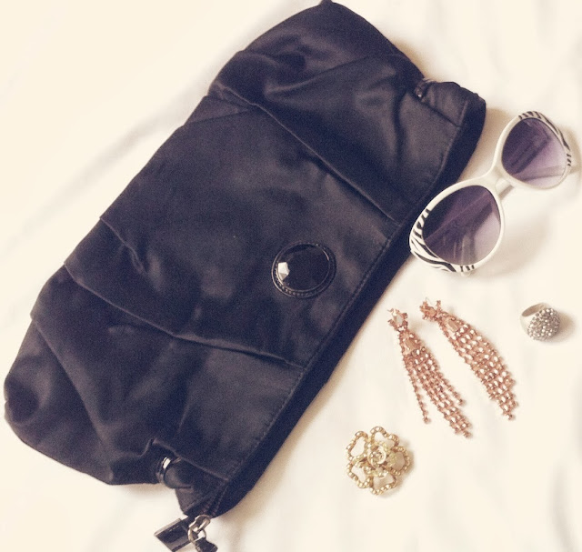 black oversized clutch, white sunglasses, jewelry