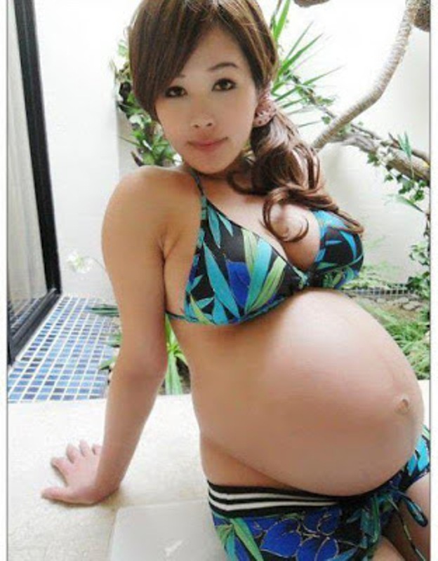 Pregnant woman with huge boobs