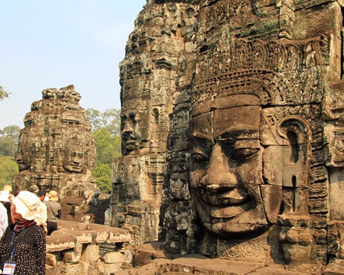Angkor Thom and faces of Kannon( Deity of Mercy)  : metropolis ruins of Angkor dynasty, end of the 12th century  