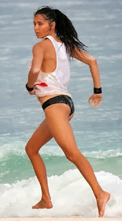 Adriana Lima wears a Black Bikini and Coca Cola at Tulum, Mexico