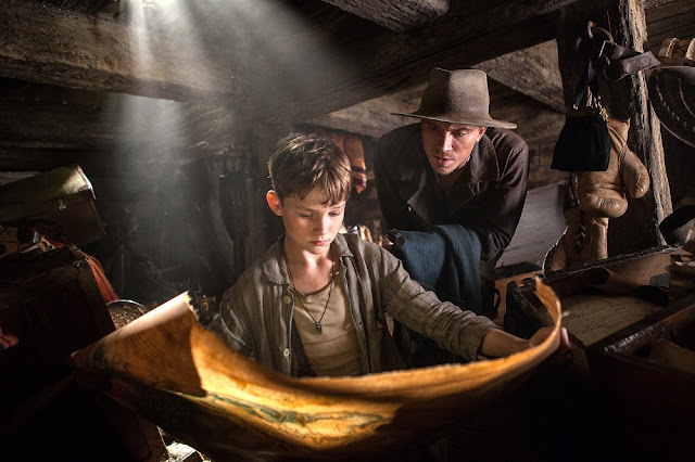 Levy Miller plays the titular character while Garrett Hedlund portrays James Hook. levy miller garrett hedlund pan 2015 movie still