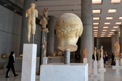Back of Blonde Boy's head and Kritios boy (2012) Archaic room, from behind the Blonde Boy and the Kritios Boy