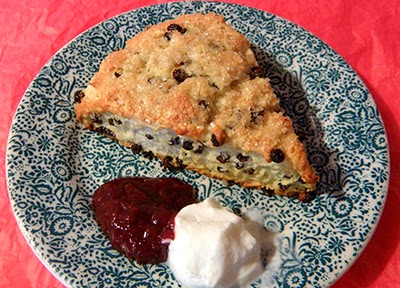 Plate with currant scone and condiments