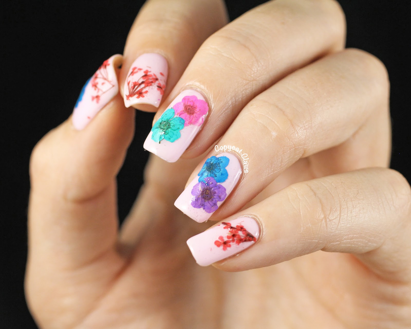 3. Festive Poinsettia Nail Art Design with Dried Flowers - wide 8