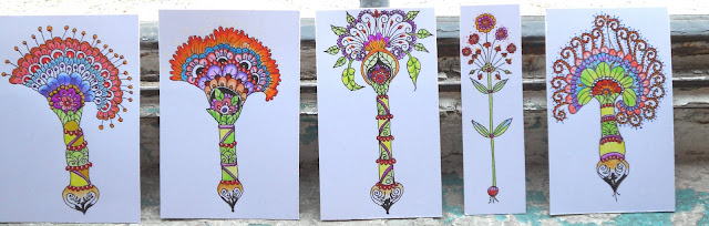 Picture of all my miniature colourful flower drawings lined up against the window