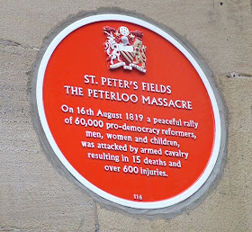 Photograph of the memorial plaque on the former site of the Free Trade Hall