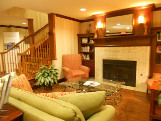 a living room with a fireplace and a couch