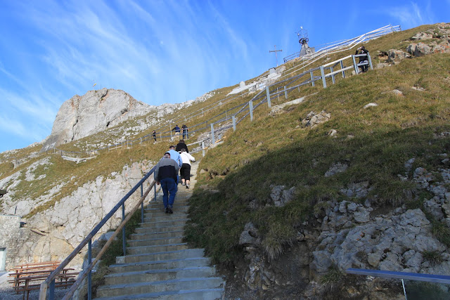 walking up on the steps in order to see the overview of Pilatus Kulm (Mount Pilatus) in Lucerne, Switzerland walking up on the steps in order to see the overview of Pilatus Kulm (Mount Pilatus) in Lucerne, Switzerland