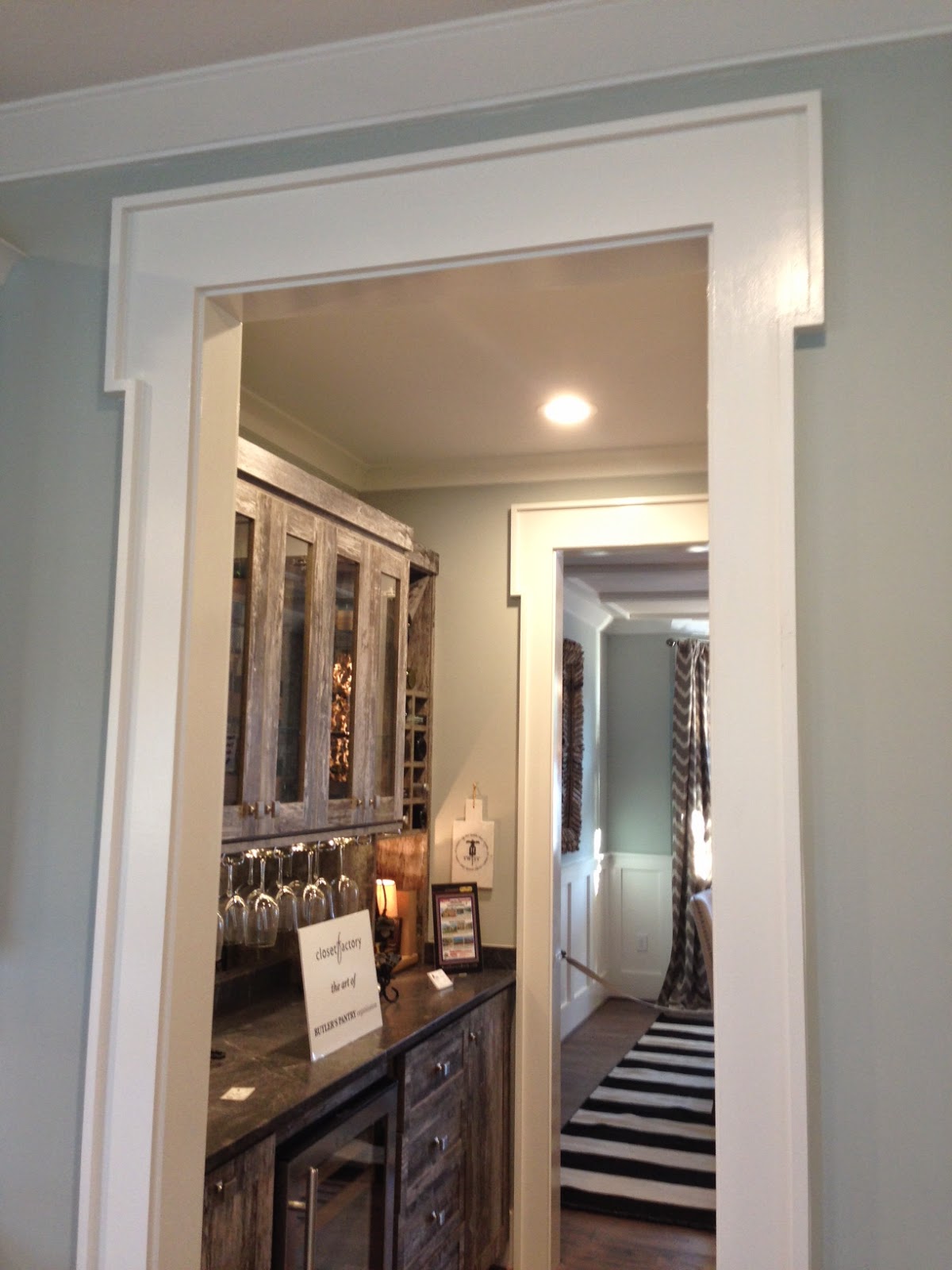 Herringbone kitchen backsplash , note the great wet bar flowing between the kitchen and dining room