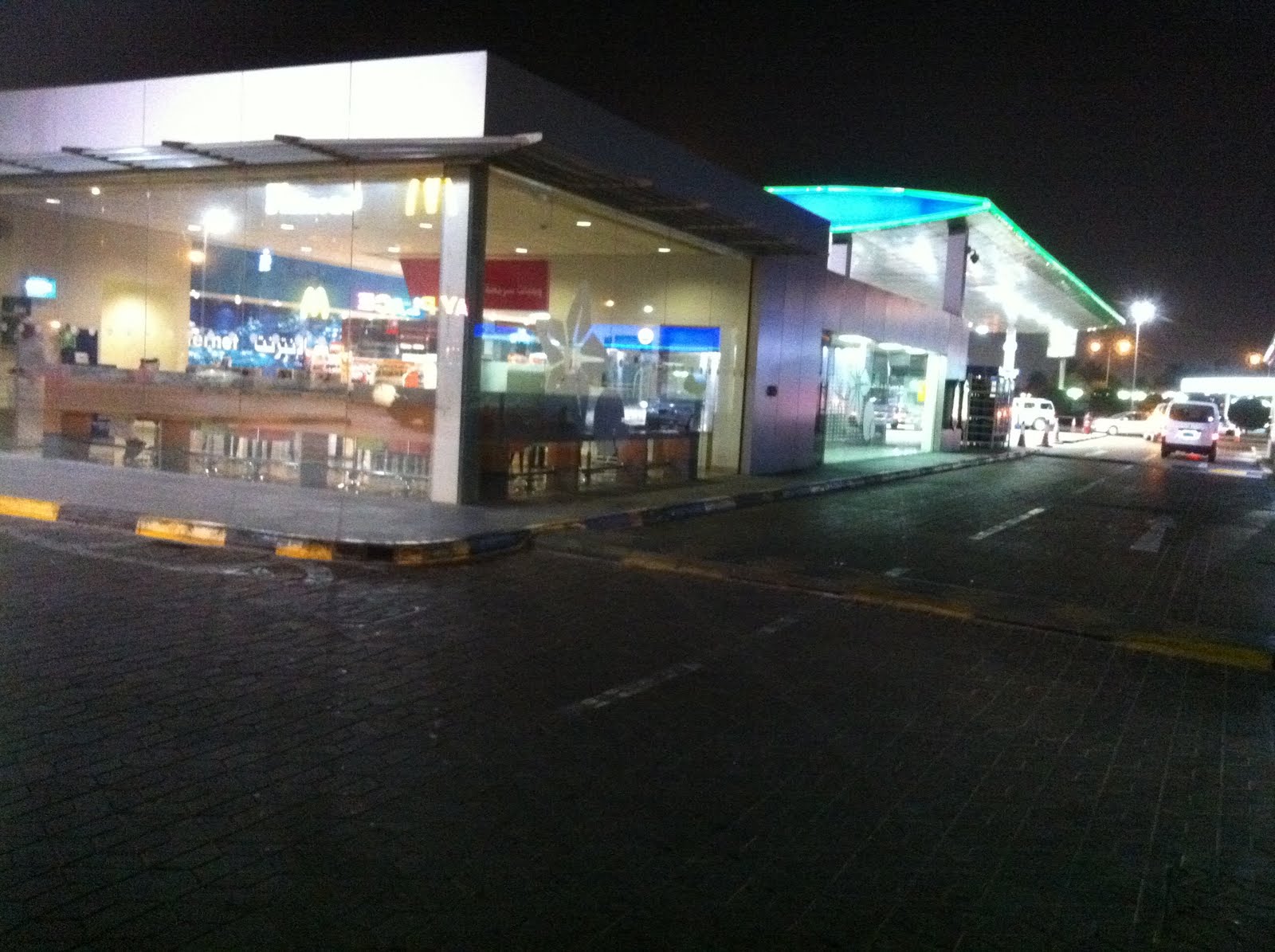 Qatar Culture Club WOQOD Petrol Station in Doha Examining Social