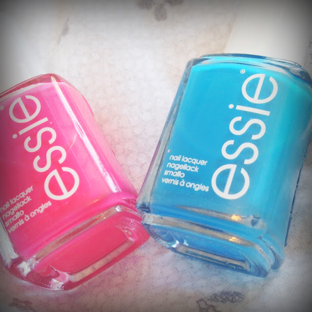 Photo of Essie nail polishes in Status Symbol and Strut Your Stuff pink and blue