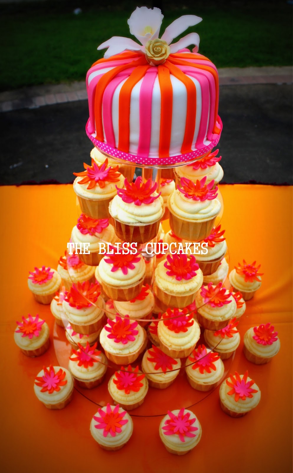 The Bliss Cupcakes Fushia and Orange Theme Wedding Cake and Cupcakes Tower