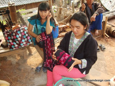Young Hmong women with their embroidery Young Hmong women with their embroidery