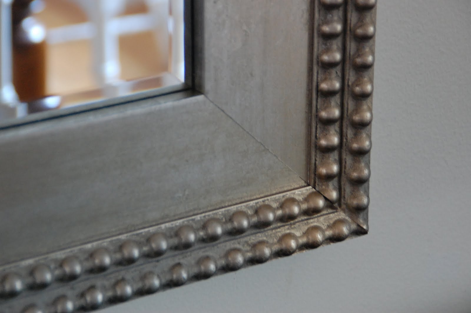 Lisa Moves black sideboard + nailhead mirror