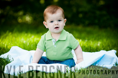 Baby sitting on blanket in grass at William Paca House Gardens