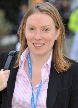 Tory MP Tracey C carries  a bag of evidence, usable to expose Channel 814 stigma slur re East End