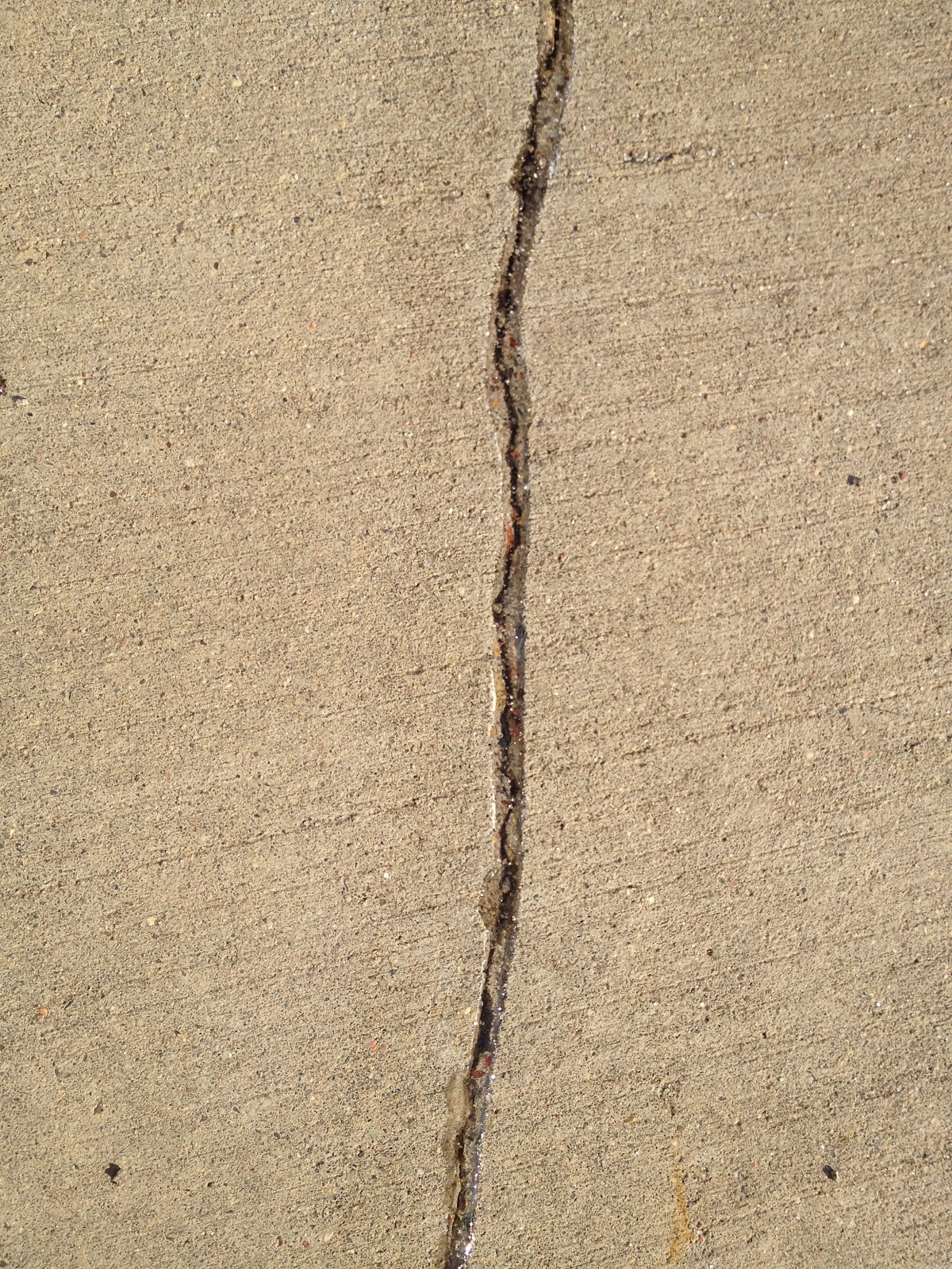 how to fix hairline crack in concrete driveway
