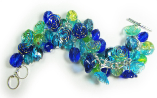 Vintage Style Glam Bracelet Dramatic bracelet with stunning blue flower buttons and clusters of shiny Czech beads