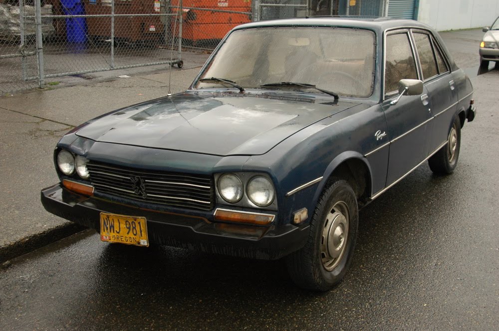 OLD PARKED CARS.: 1979 Peugeot 504 Diesel Sedan. OLD PARKED CARS.: 1979 Peugeot 504 Diesel Sedan.
