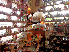 Interior view of The Old Tythe Barn dolls house shop at Blackheath
