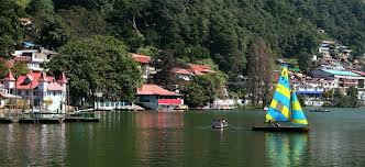 tourists taking boat ride in nainital hill station in uttarakhand in north india
