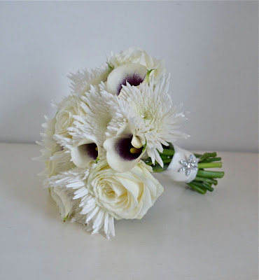 Kirsty 39s white and purple wedding bouquet finished with a diamante flower