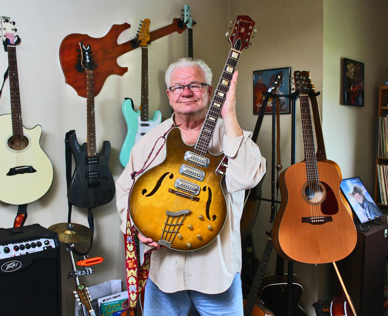 Wall Axe Custom Guitar Hangers Bob Proudly Showing Off His Hollow Harmony Among Room Of Wall Axe Custom Guitar Hangers