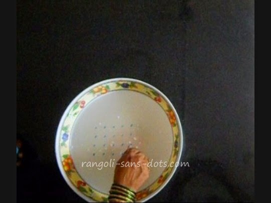 rangoli with 5 dots on water floating-rangoli1.jpg