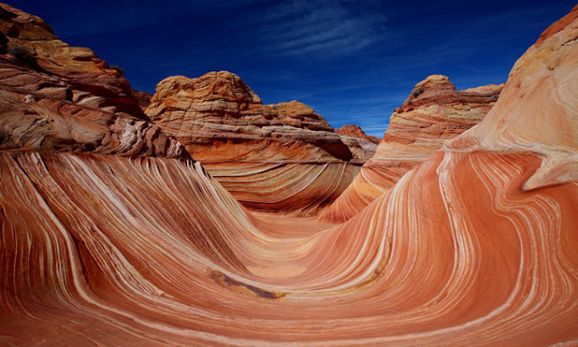 The Wave is on the slopes of the Coyote Buttes, which are in turn located in the Paria Canyon-Vermilion Cliffs Wilderness, on the Colorado Plateau, Arizona