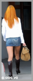 Girl in jean mini skirt on high heels