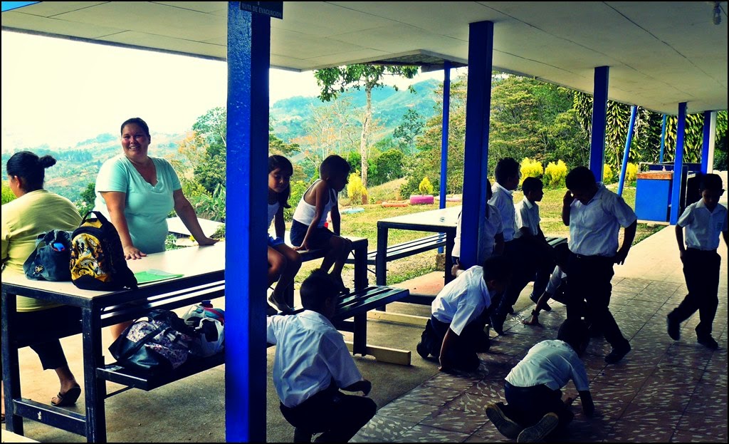 students at matasanos, costa rica elementary school playing marbles