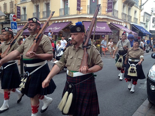 Walking the parade in Cannes with kilts and guns