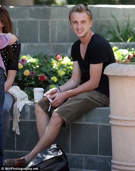 Tom Felton smoking a cigarette (or weed)