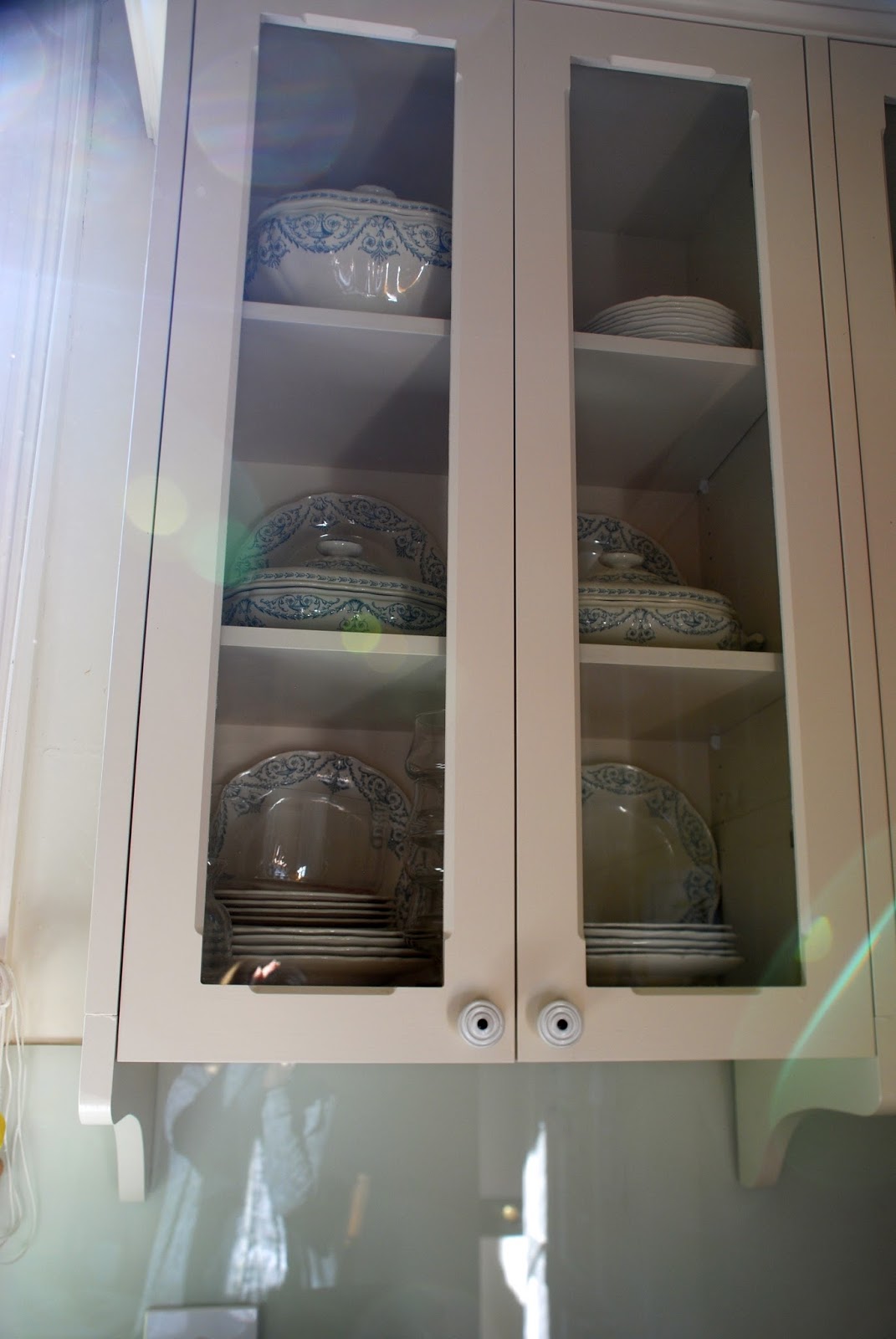 Decorative kitchen cabinet knobs And here are the overhead cupboards which have a decorative bracket