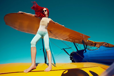 top fashion photographers nyc, woman hang gliding, woman flying, woman on airplane