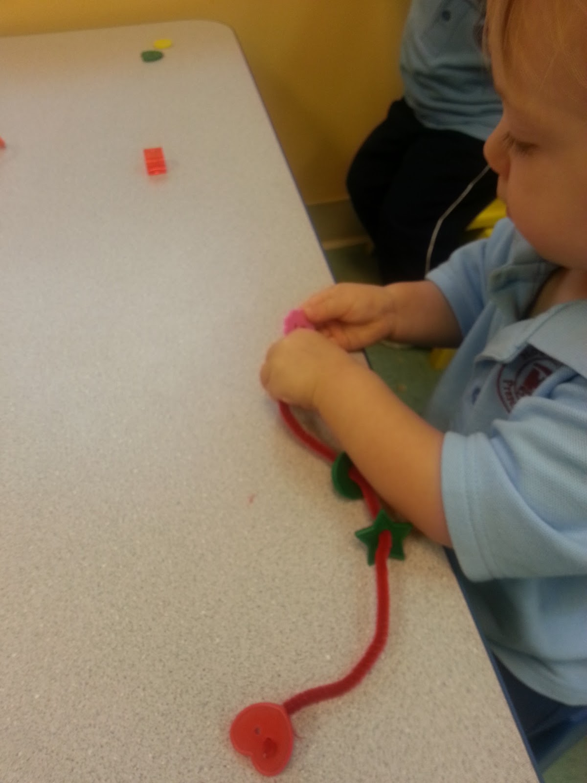to the HH Toddler Classroom! Threading Beads, Stacking Cheerios on spaghetti noodles