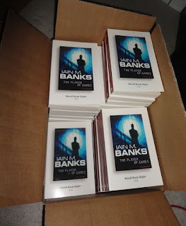A box full of World Book Night books - Iain M. Banks, The Player of Games