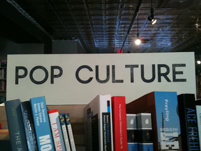 POP CULTURE section sign with large space between the L and T
