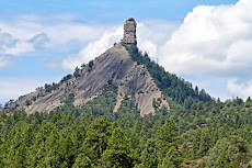Monolith of Chimney Rock, CO, capped by Cretaceous Pictured Cliff Formation over Lewis Shale
