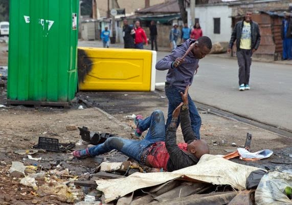 This Is Too Bad!! People Stood By While This Man Was Stabbed To Death In SA [See Photos]