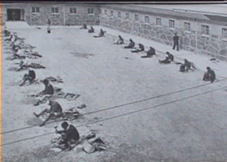 nelson mandela's prison yard on robben island with political prisoners breaking rocks