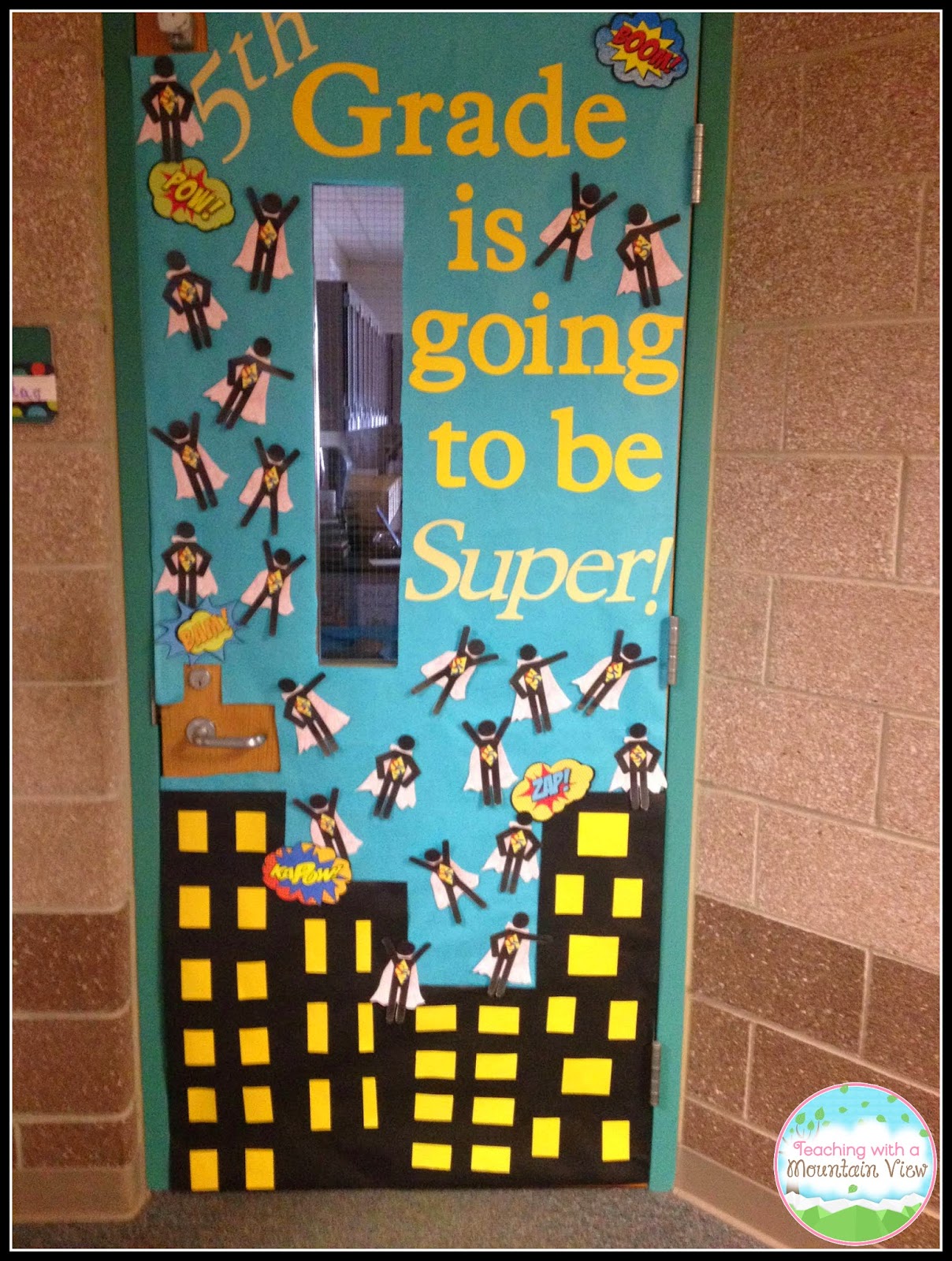Superhero themed classroom door decoration idea.