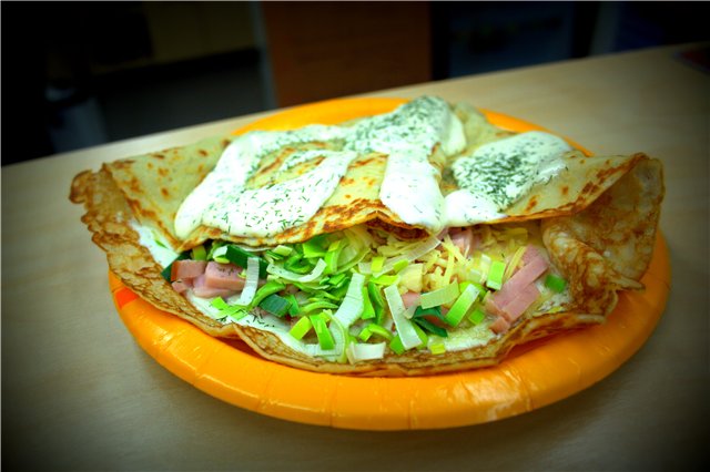 Pancake with pork ham, onions, cheese and sauce Pancake with pork ham, onions, cheese and sauce