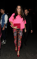 Katie Price looks amazing in a pink top and spandex