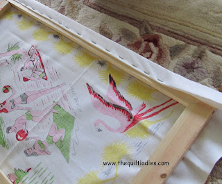 vintage tablecloth and made it wall art